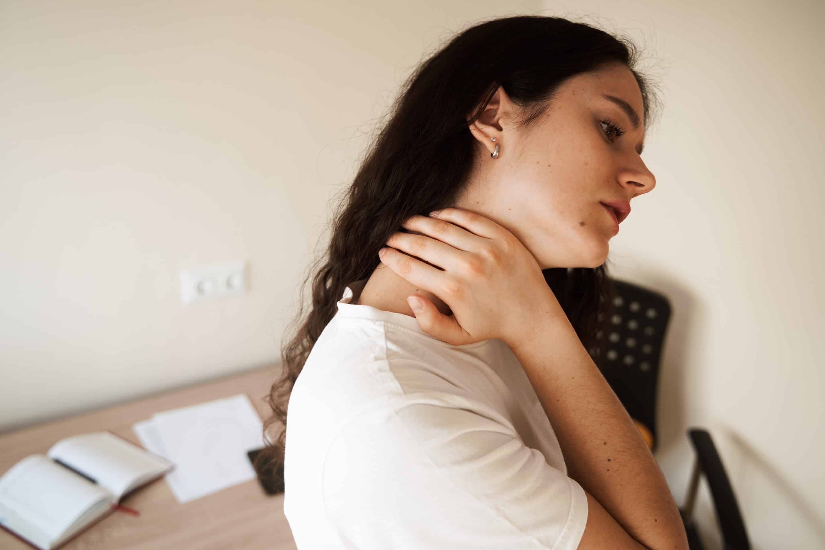 Cervical spine osteochondrosis is radicular syndromes of young woman. Attractive girl feel spine pain because of spinal nerves compression.